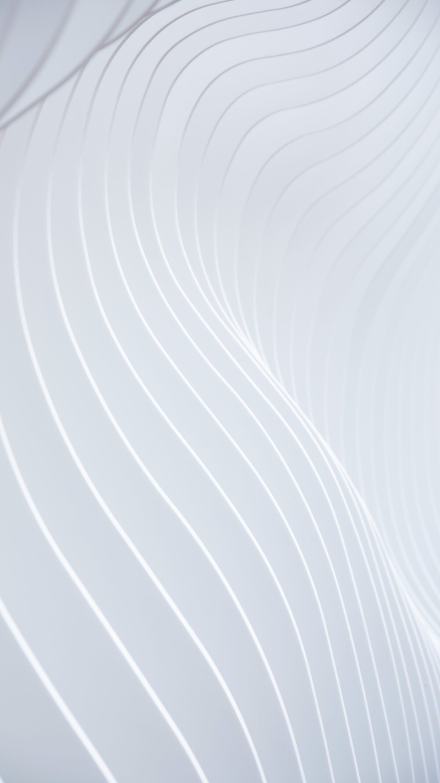 Abstract 3D wallpaper featuring smooth, repeating wavy lines or ridges in gradient shades of cyan and blue, creating a flowing texture.