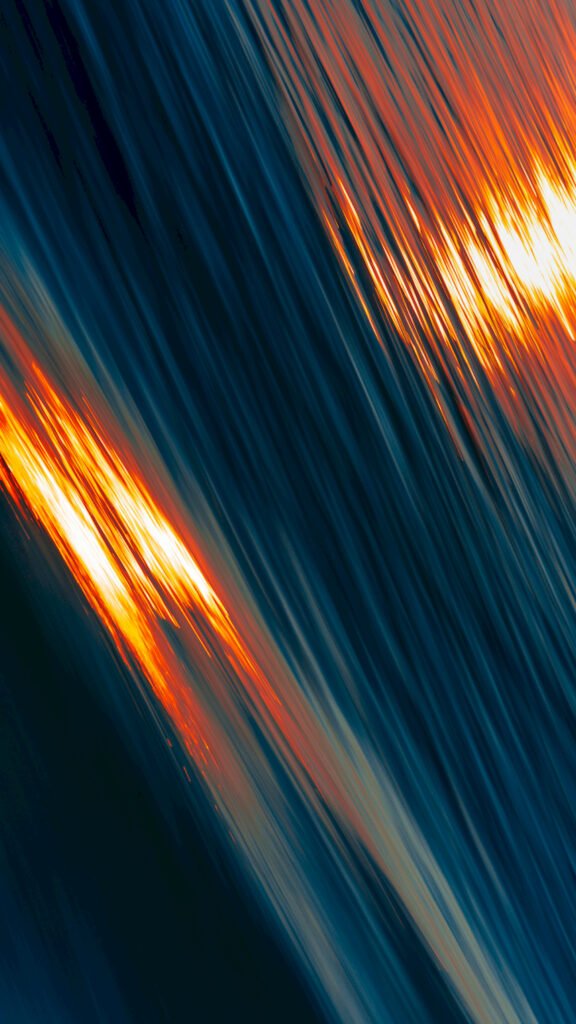 Abstract wallpaper featuring diagonal streaks of bright orange and dark blue light, creating a fast motion blur effect across the screen.