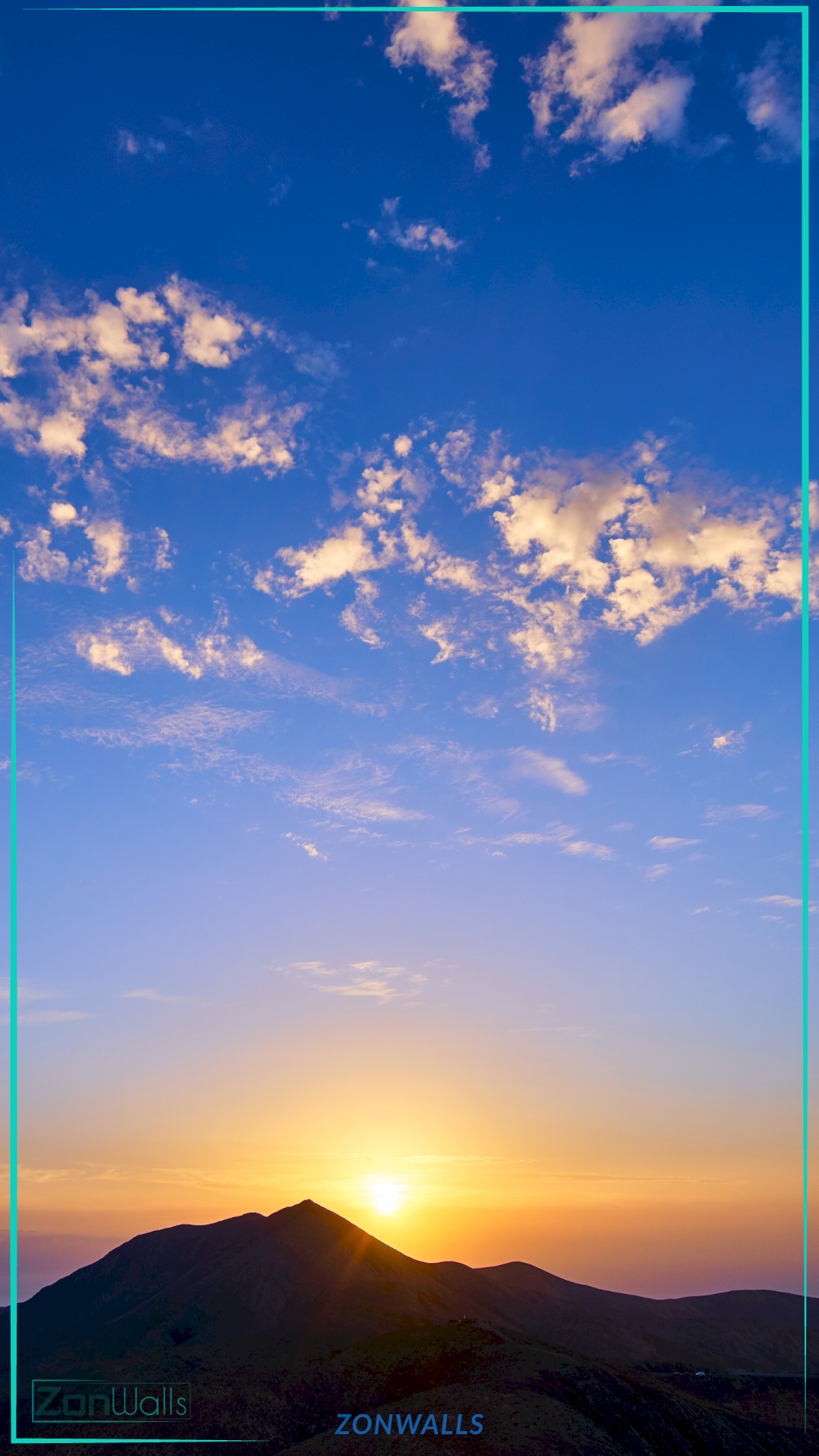 Vertical nature wallpaper featuring a bright golden sun rising behind a dark mountain silhouette, illuminating a vast blue sky with scattered white clouds.