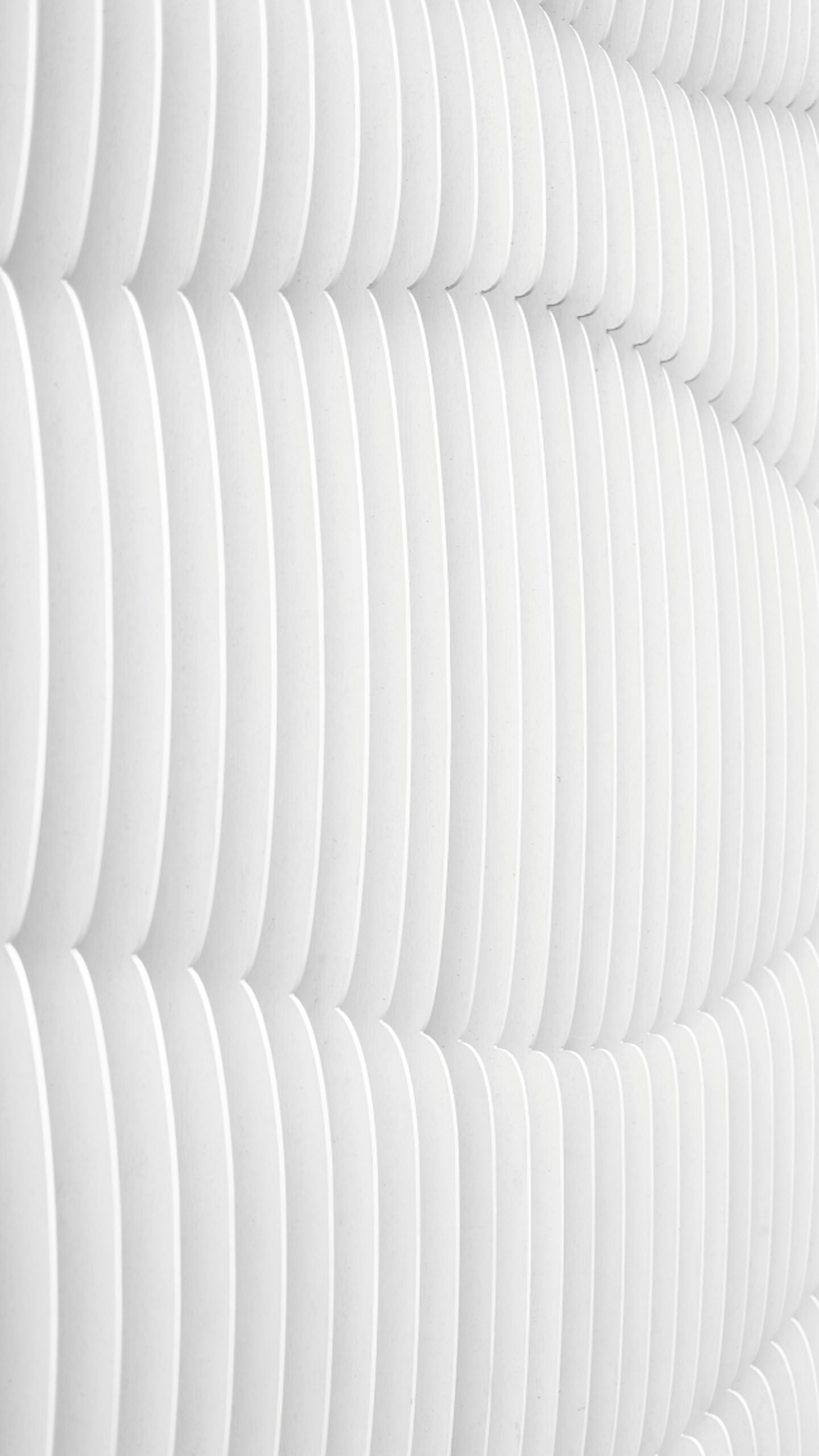 Abstract wallpaper featuring repeating vertical white curved slats or lines with soft grey shadows, creating a clean 3D wave pattern.