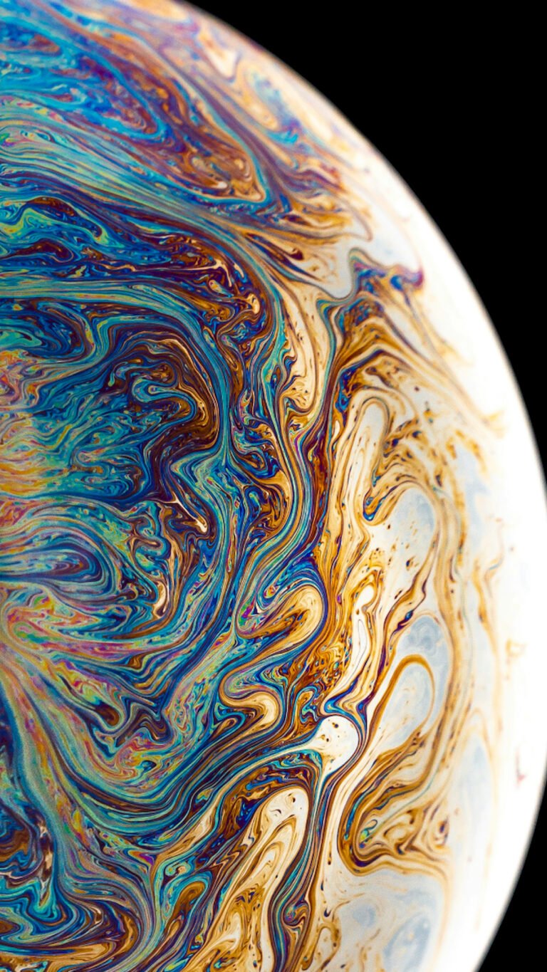 "Vertical macro close-up of a soap bubble surface with swirling blue and gold psychedelic patterns against a black background, resembling a colorful planet."