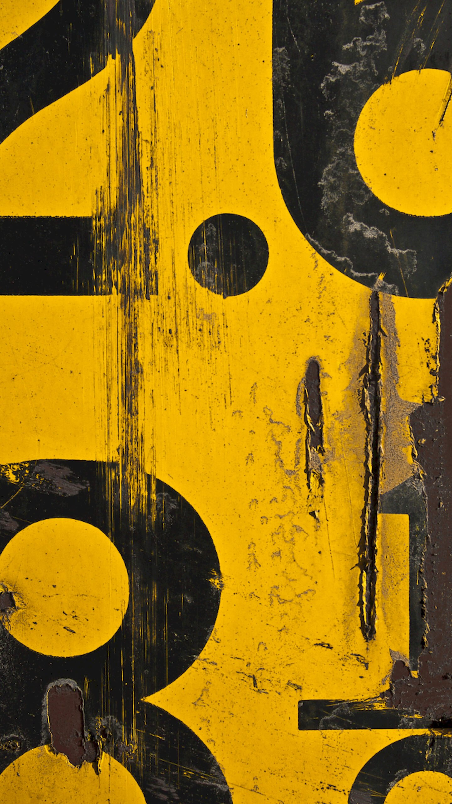 Close-up vertical texture of a yellow industrial surface featuring large, partially visible black numbers, heavy scratches, and peeling paint revealing rust underneath.